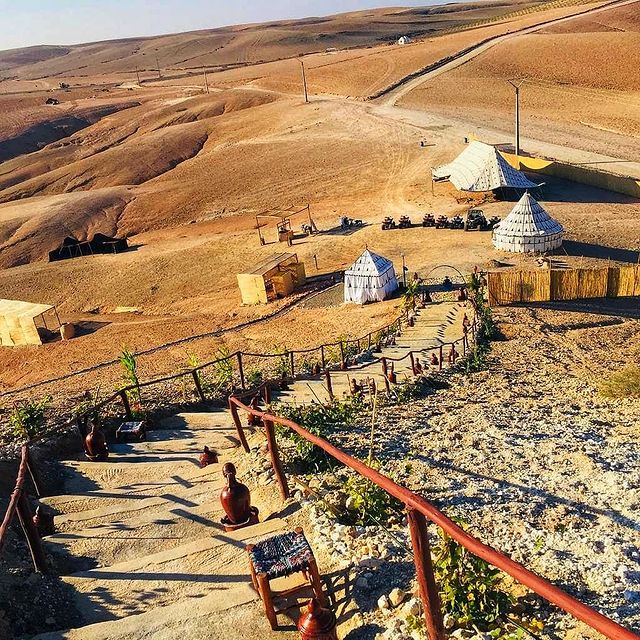 Luxury desert camp in Agafay with traditional tents and panoramic views