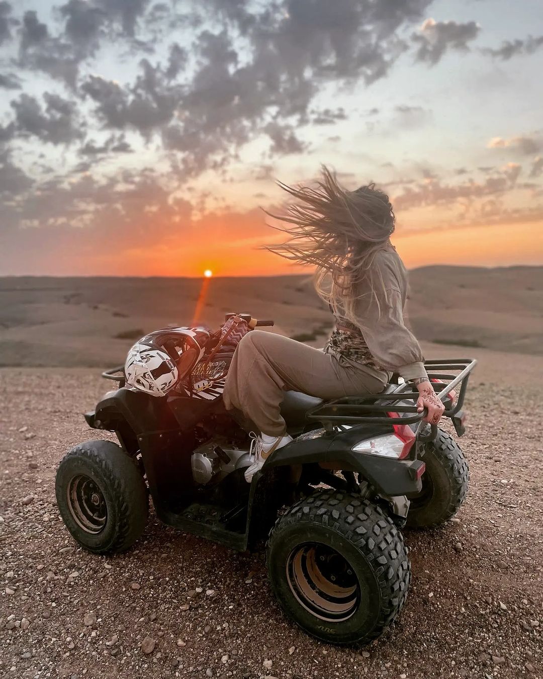 Quad biking adventure in Agafay Desert at sunset